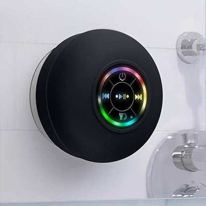 Compact portable Bluetooth speaker held in hand