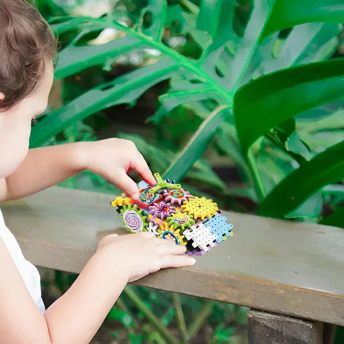 Kids building and playing with gear blocks