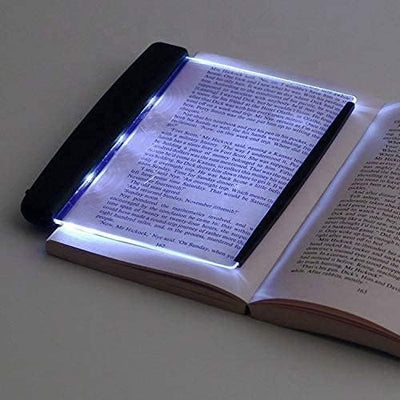 LED reading panel light placed over book page