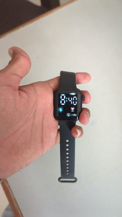 Unisex digital LED watch worn on wrist showing the sleek square face and silicone strap